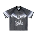 Omirad AIM 18 black mesh jersey t-shirt front view with gothic logo, crest graphic, and geometric spike shoulder design