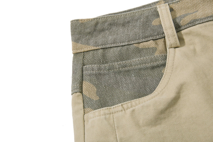 Close-up of beige camo side waistband and front pocket seam