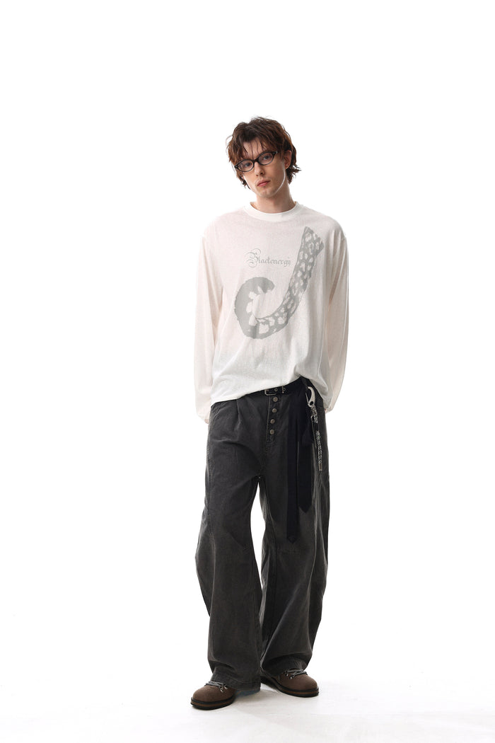 White long sleeve tee worn full length with abstract front graphic