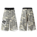 Front and back view of grey camo wide-leg distressed jorts with frayed hem, black waistband, and graphic patch