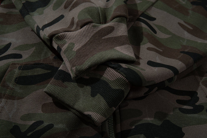 Close-up of camouflage sleeve cuff and ribbed knit hem