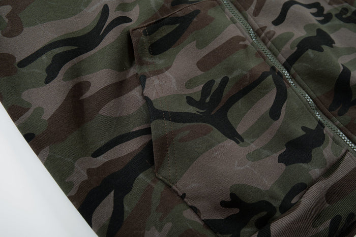 Close-up of camouflage front pocket and side seam on hoodie