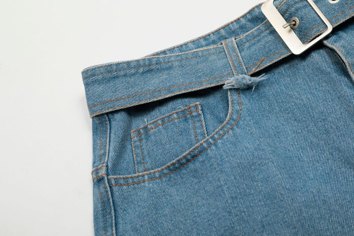 Close-up of front pocket and belt loop on light wash denim jorts