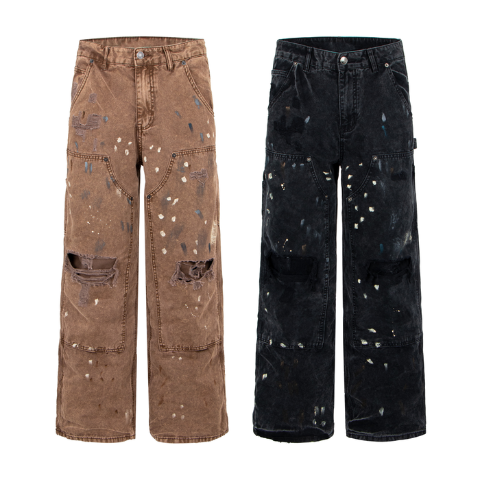 Front view of brown acid-washed distressed carpenter denim pants with paint splatter and torn knee detailing