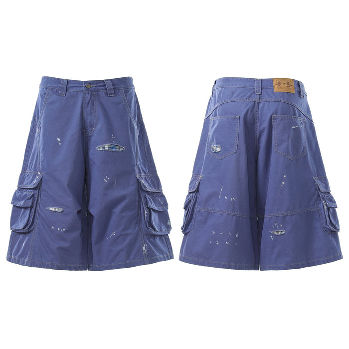 Blue utility cargo shorts, front and back views with wide legs and distressed details