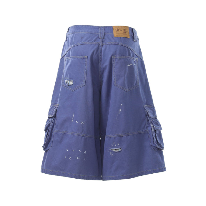 Blue cargo shorts back view with square patch pockets, leather label, and distressed marks