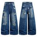 Front and back view of medium blue distressed wide-leg denim jeans with ripped detailing and vintage wash finish
