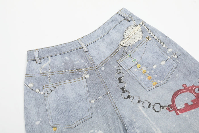 Close-up of back waistband and pocket on light wash denim shorts with chain and gem details