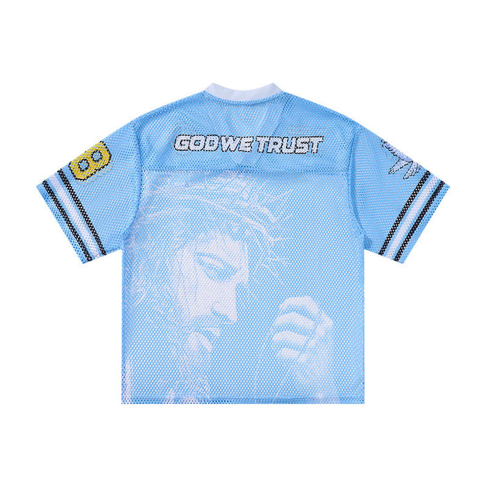 Light blue mesh jersey T-shirt with God We Trust lettering and graphic face print, streetwear style