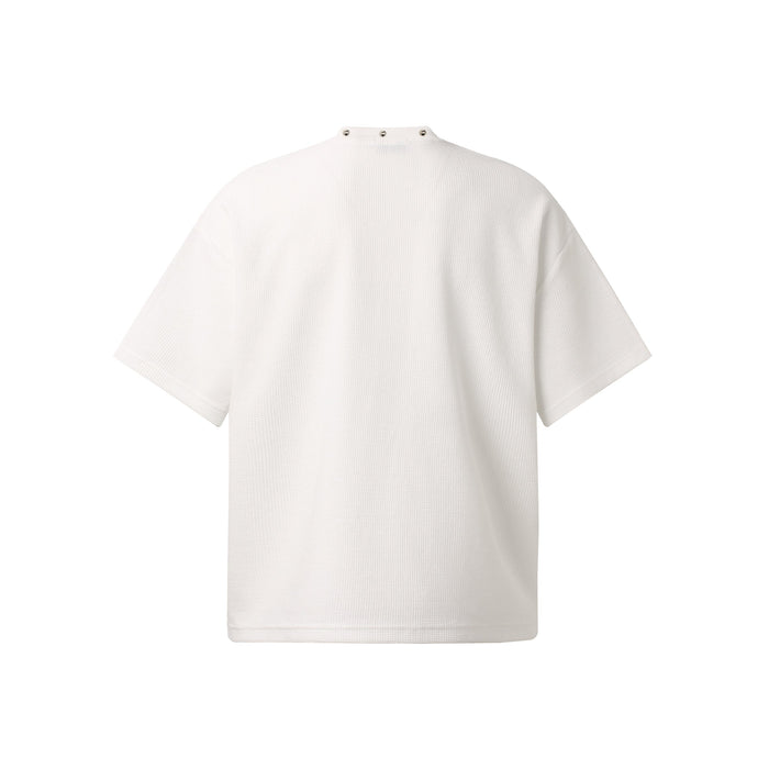 White oversized waffle-knit streetwear tee with relaxed short sleeves and snap-button mock neck detail