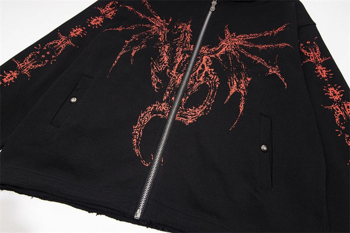 Close-up of black zip-up hoodie front with red dragon print and pocket detail