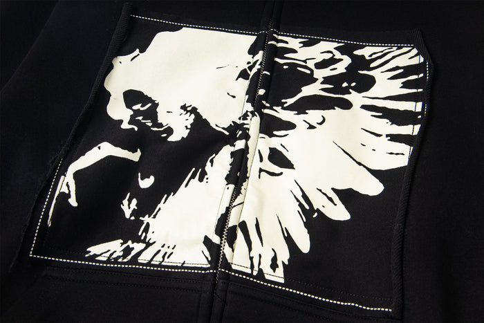 Close-up of white skull graphic printed on the front chest panel