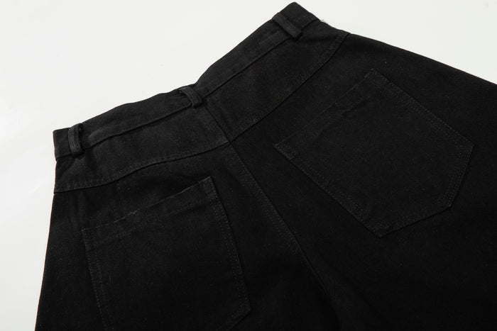 Close-up of back yoke and pocket on black wide-leg pants