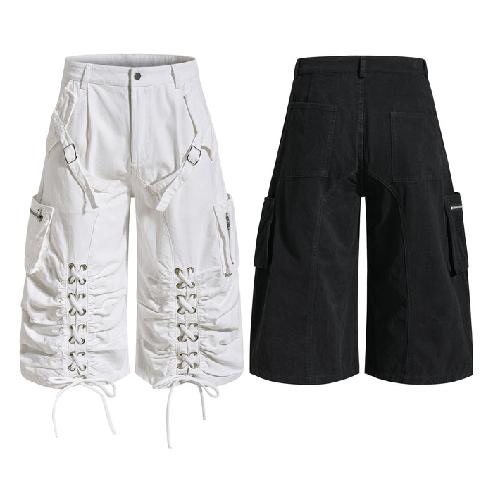 White and black utility cargo shorts with lace-up leg details, front and back views