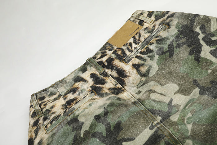 Upper back of leopard camo cargo shorts showing label patch, waistband, and rear pocket