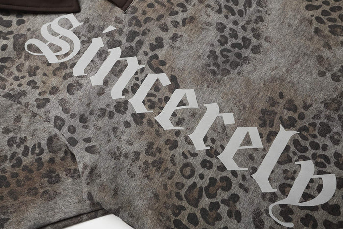 Oversized leopard print polo tee with gothic Seakoff logo on textured gray streetwear shirt