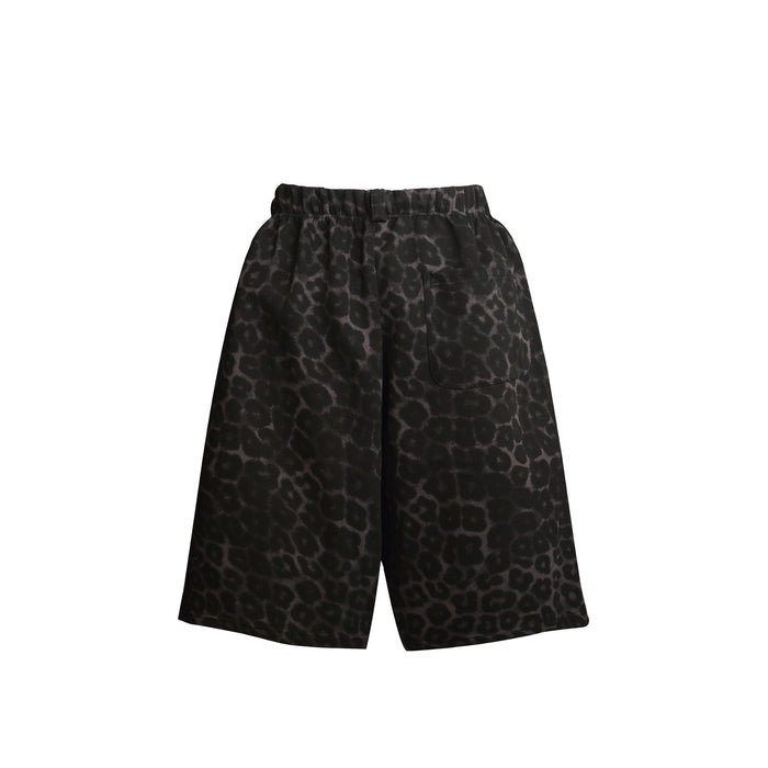 Back view of black leopard print loose shorts with a patch pocket