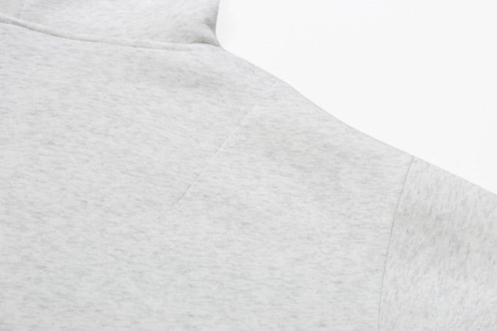 Ash grey hoodie shoulder and upper sleeve seam close-up