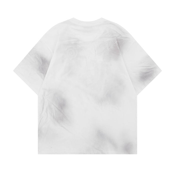 White washed oversized graphic tee with subtle cloud-dye texture and relaxed short sleeves on a clean background