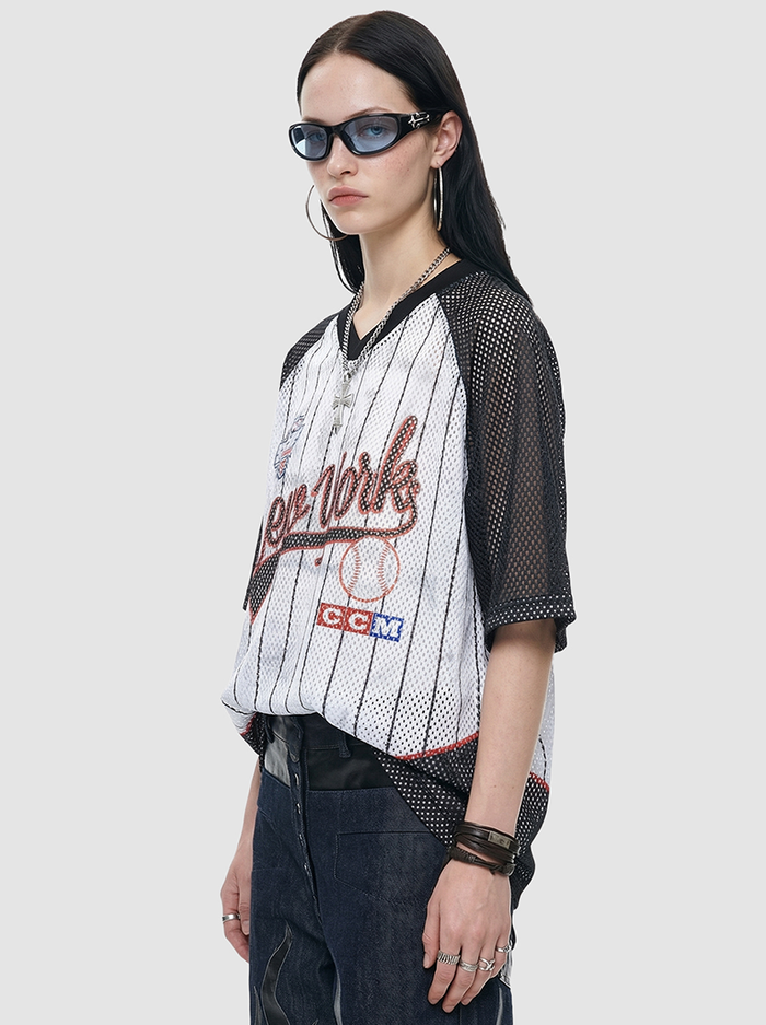 Model wearing a black mesh New York 89 pinstripe jersey T-shirt with baseball graphics and oversized fit