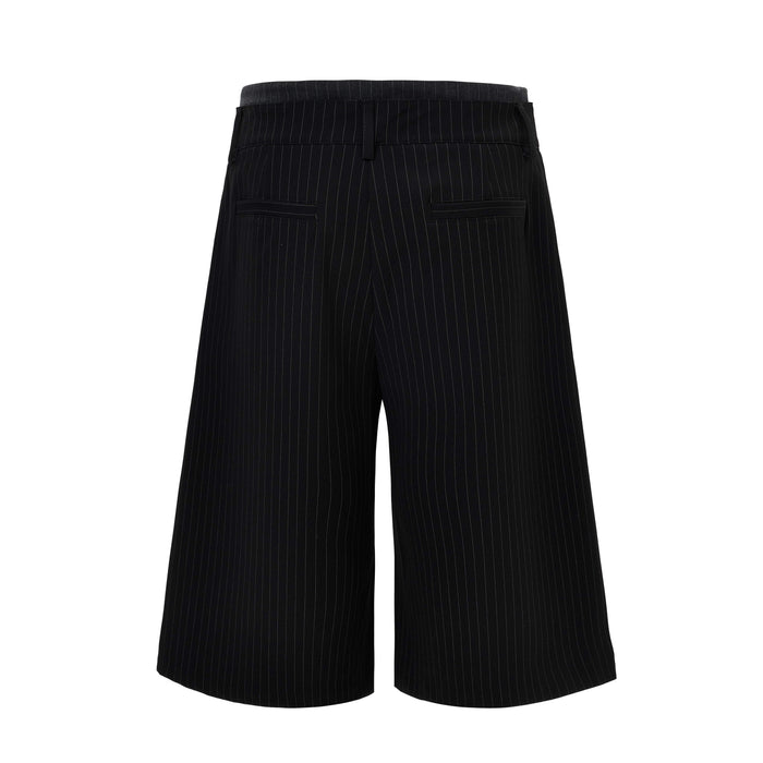 Back view of black pinstripe wide-leg shorts with welt pockets and belt loops