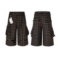 Front and back view of dark brown plaid cargo shorts with oversized 3D pockets and detachable hand charm keychain