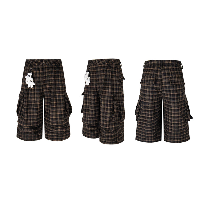 Three views of black and brown plaid knee-length cargo shorts with wide legs