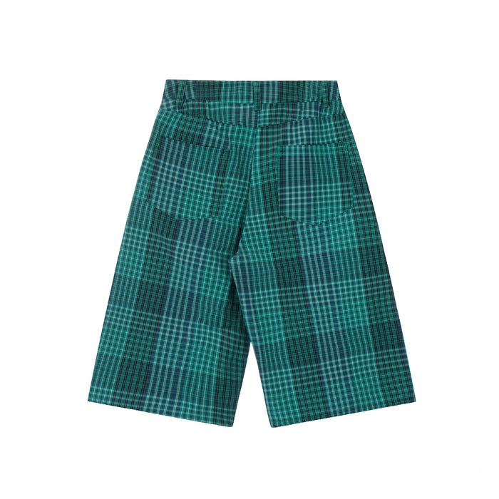 Back view of green plaid wide-leg shorts with rear patch pockets