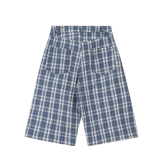 Back view of blue and white plaid wide-leg shorts with patch pockets