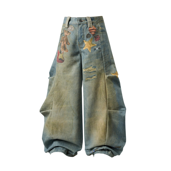 Front view of wide leg blue denim jeans with graphic prints and a high waist