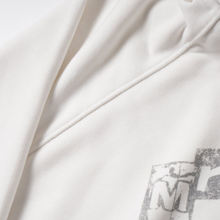 Close-up of white hoodie side seam and raglan sleeve stitching