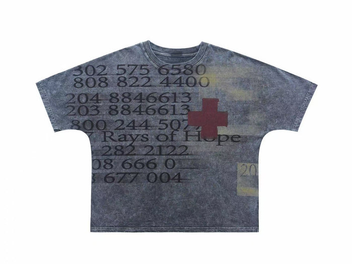 Vintage wash oversized graphic tee in faded gray with Rays of Hope text, numbers, and red cross print