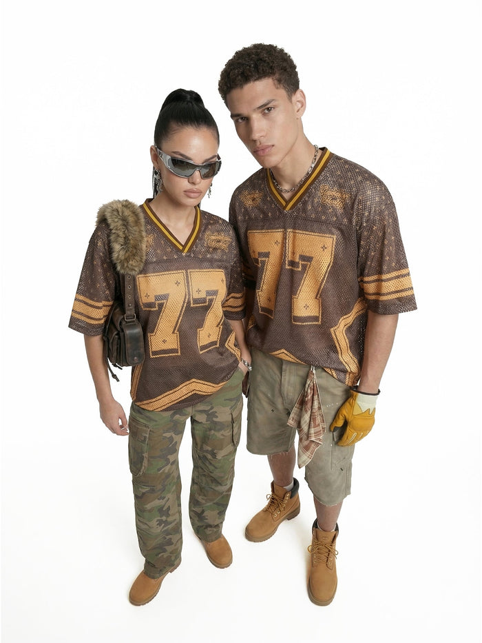 Two models wearing brown and gold Retro Star 77 mesh jersey T-shirts with oversized number graphics and V-neck trim