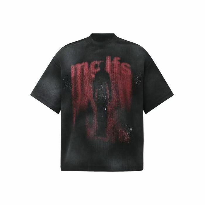 Black oversized washed tee with a red shadow figure graphic and relaxed streetwear fit