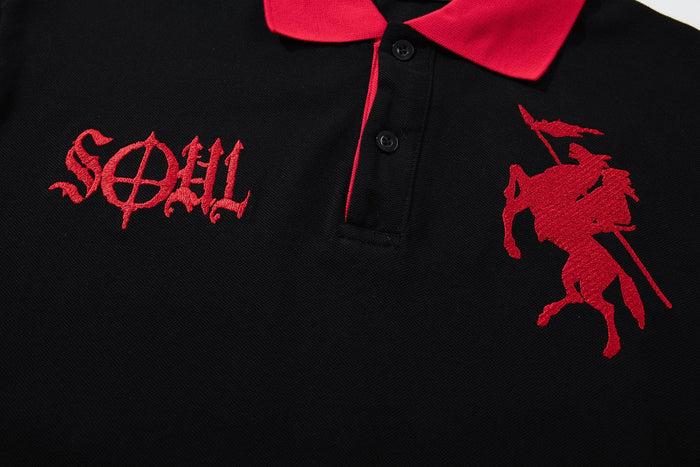 Black gothic polo tee with red collar, embroidered spirit graphics, and oversized Y2K streetwear style