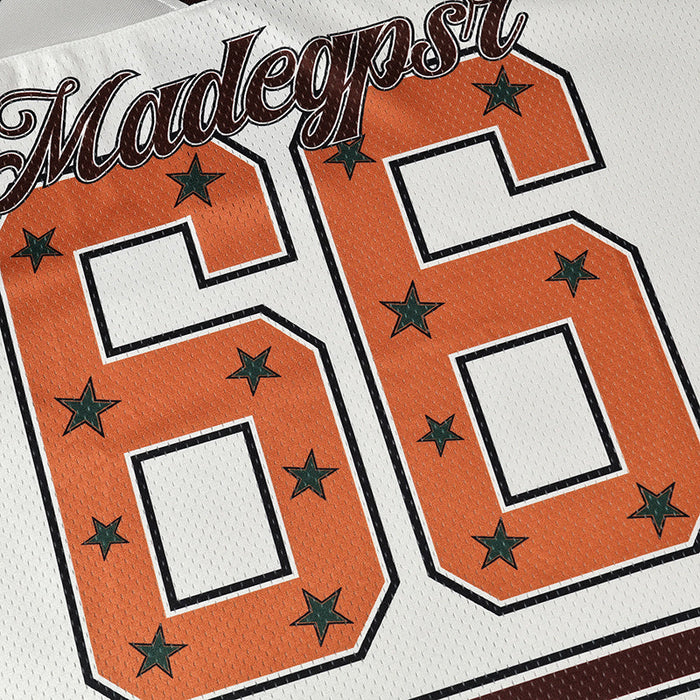 Seakoff Star varsity jersey with orange number 66 and green stars on white mesh fabric