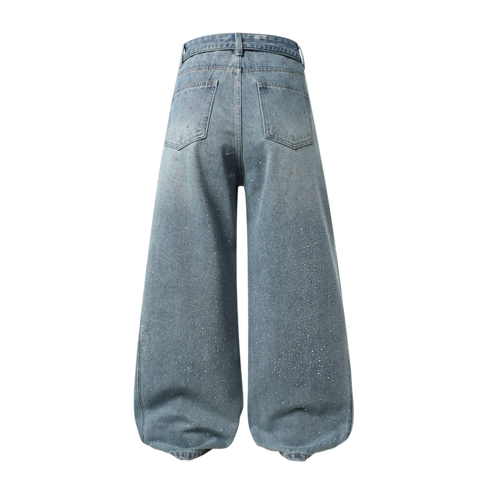 Back view of light blue wide-leg jeans with rhinestone speckles and patch pockets