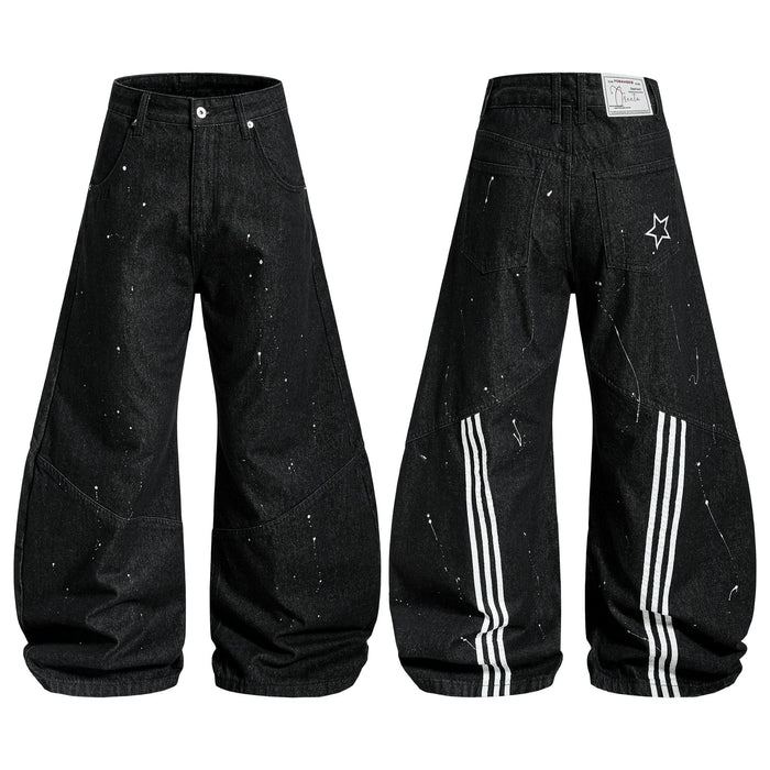 Black wide-leg jeans with white paint-splatter print, triple-stripe back panel, and star graphic detail, shown front and back