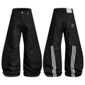Black wide-leg jeans with white paint-splatter print, triple-stripe back panel, and star graphic detail, shown front and back