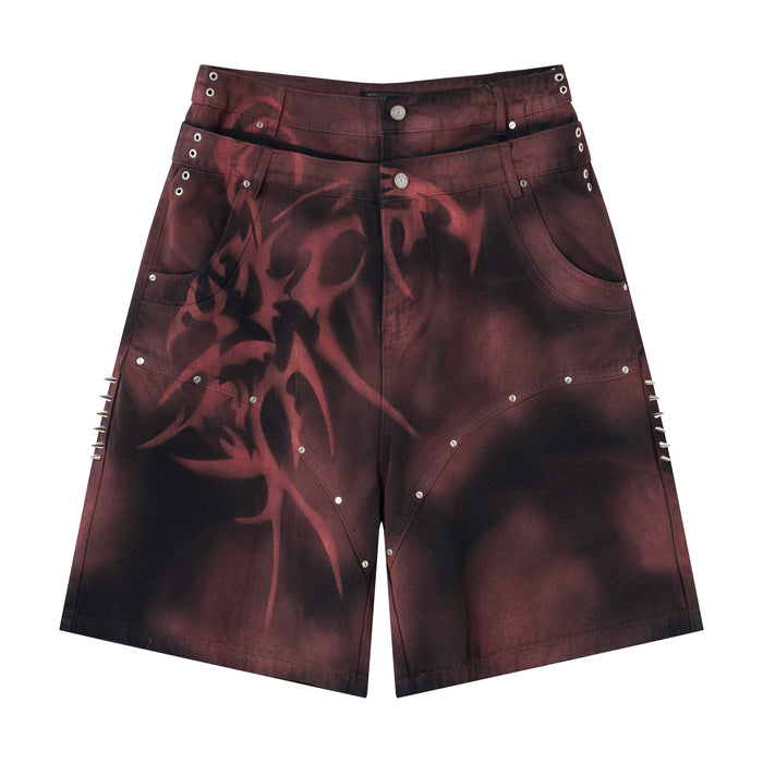 Burgundy and black denim jorts front view with tribal print and side spikes