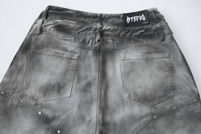 Gray denim jorts back view with plain pockets and faded black waistband