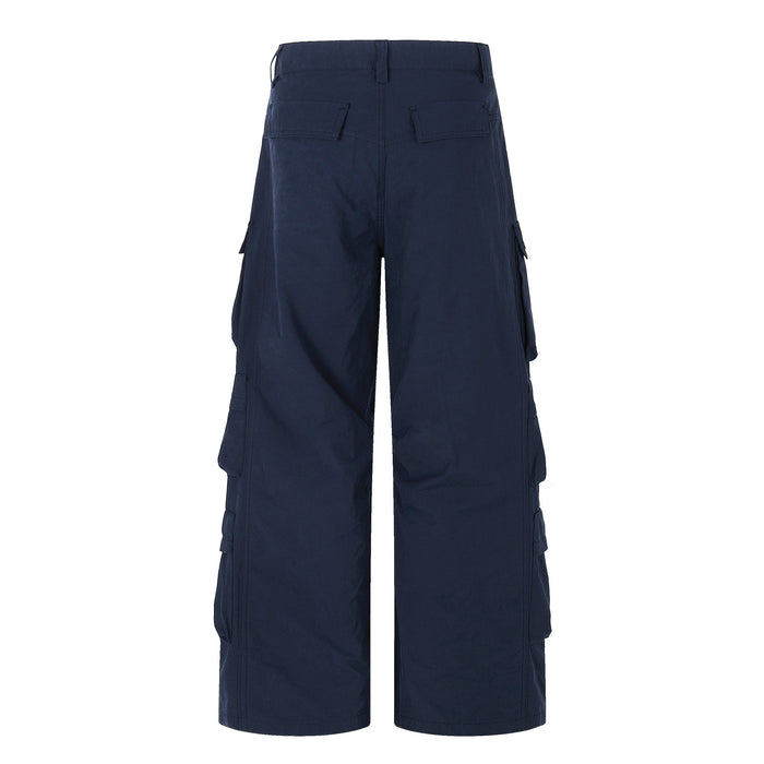 Back view of navy wide-leg cargo pants with flap back pockets and straight wide legs