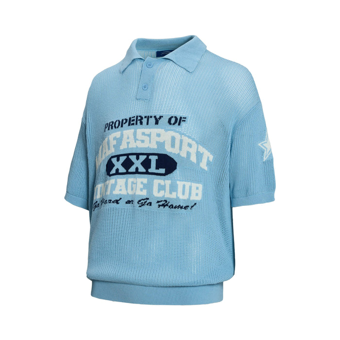 Light blue knit polo shirt with varsity-style graphic print and short sleeves on a white background