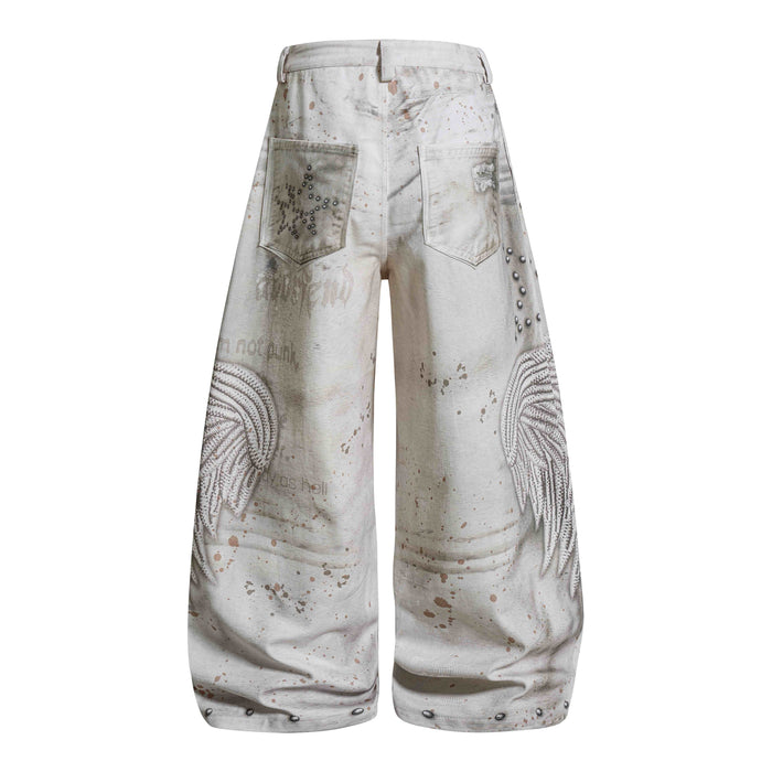 Back view of cream wide-leg jeans with back pockets, star studs, and angel wing graphics