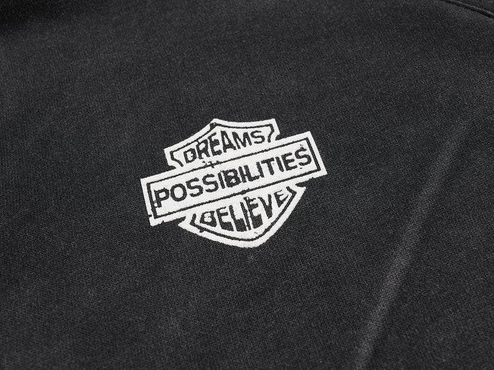 Close-up of white Dreams Possibilities Believe chest patch on black jersey