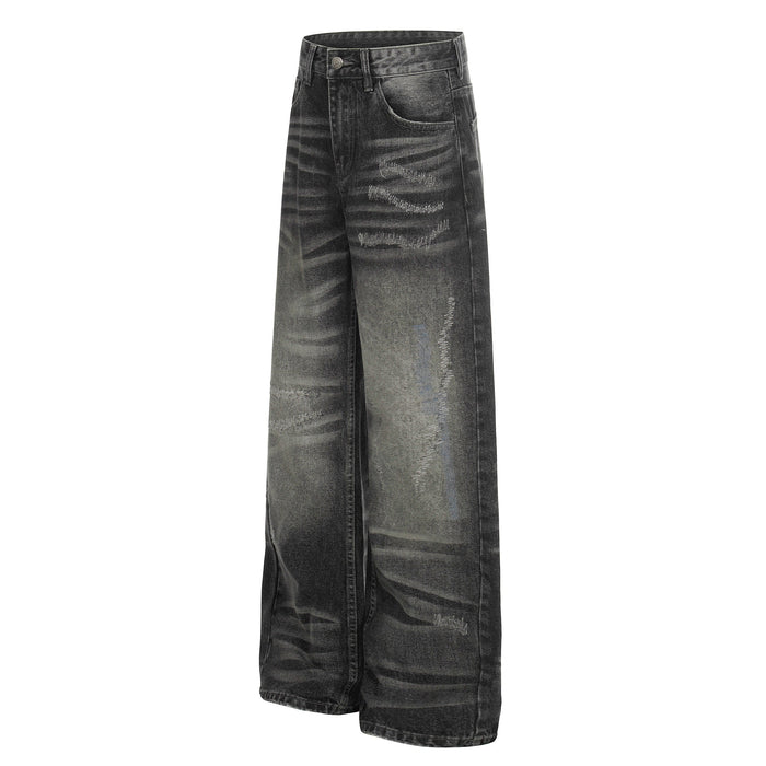 Front three-quarter view of black distressed wide-leg denim pants with fading and whiskering