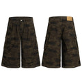 Front and back view of wide-leg dark olive camo cargo shorts with oversized flap pockets and deep front pleats