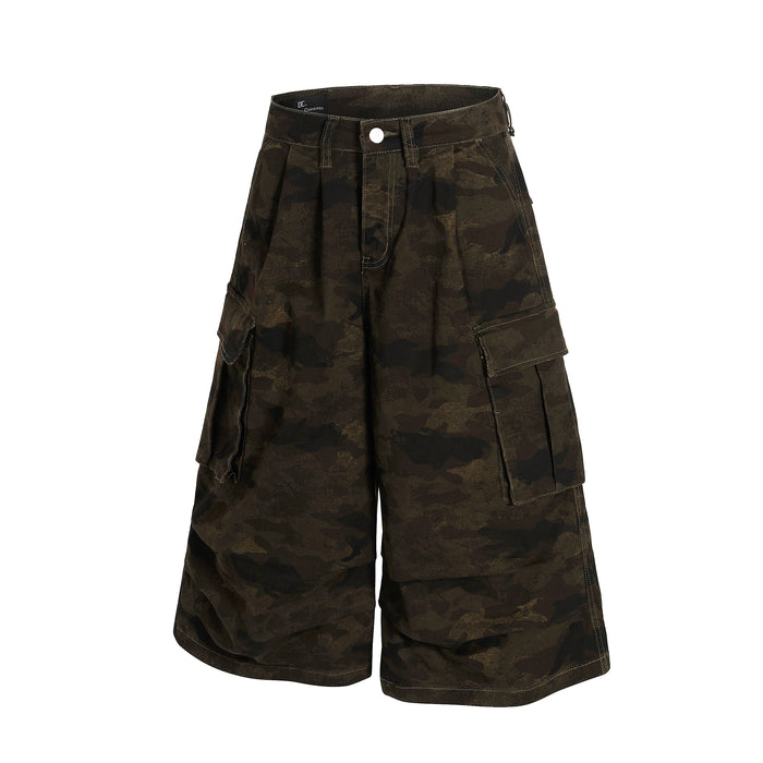 Front view of camo cargo shorts showing pleats, flap pockets, and wide legs
