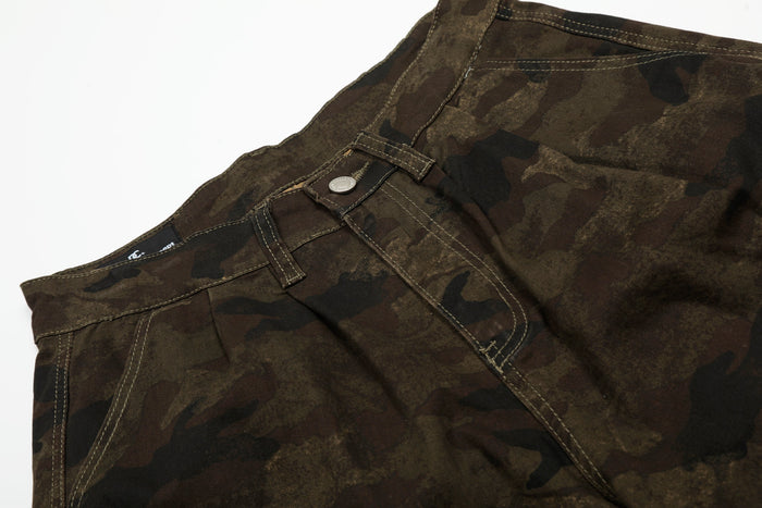 Close-up of front waist on camouflage cargo shorts with button and belt loop