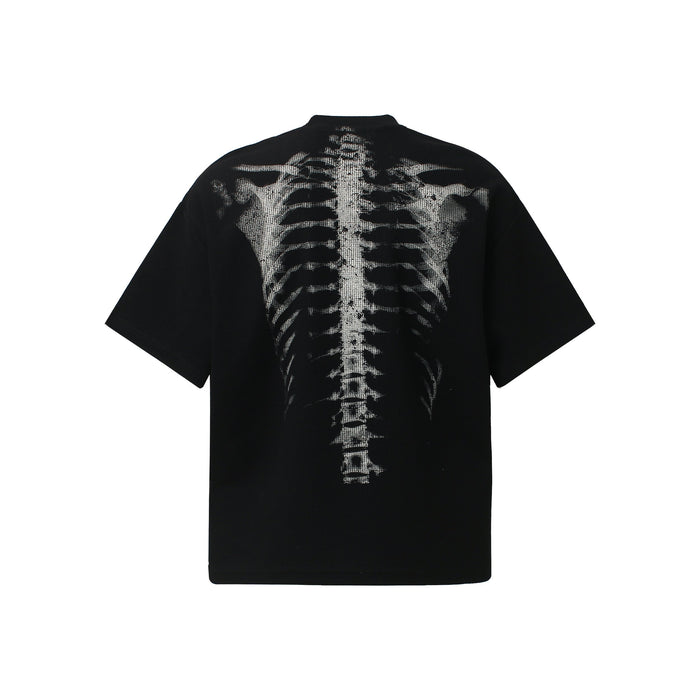 Black oversized streetwear tee with a white x-ray ribcage and spine graphic printed across the back